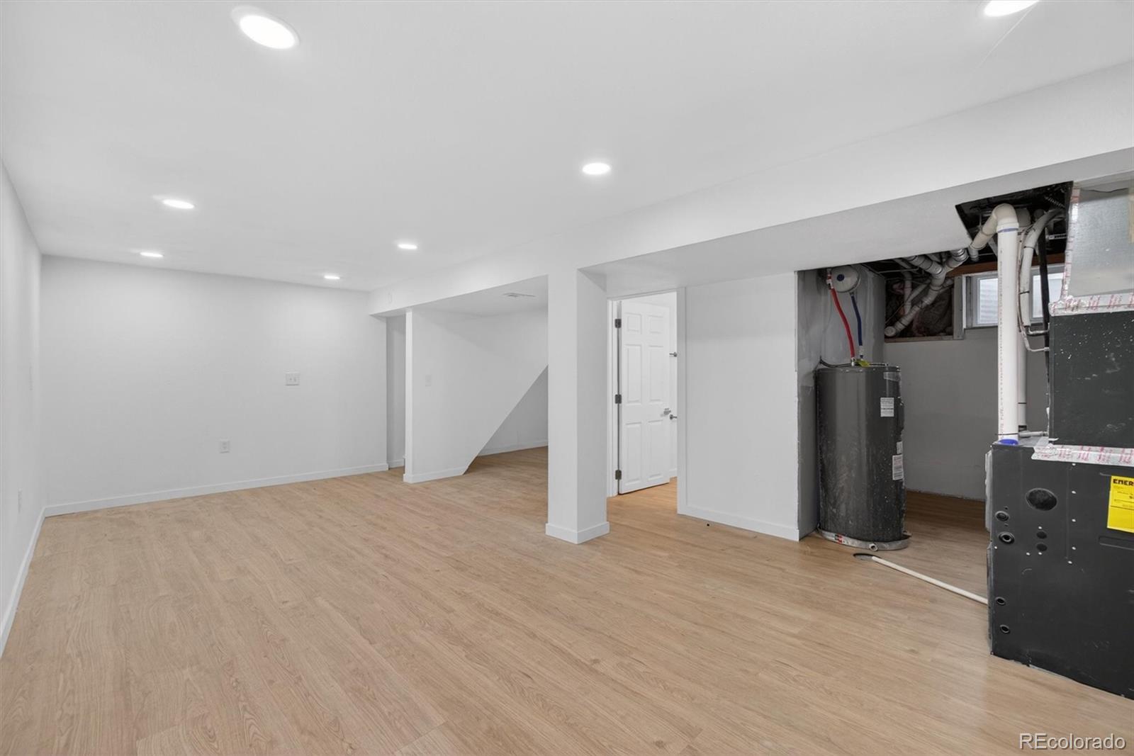 7620 Acoma Court Denver, CO 80221 - Photo 26 of 39 a view of empty room with wooden floor