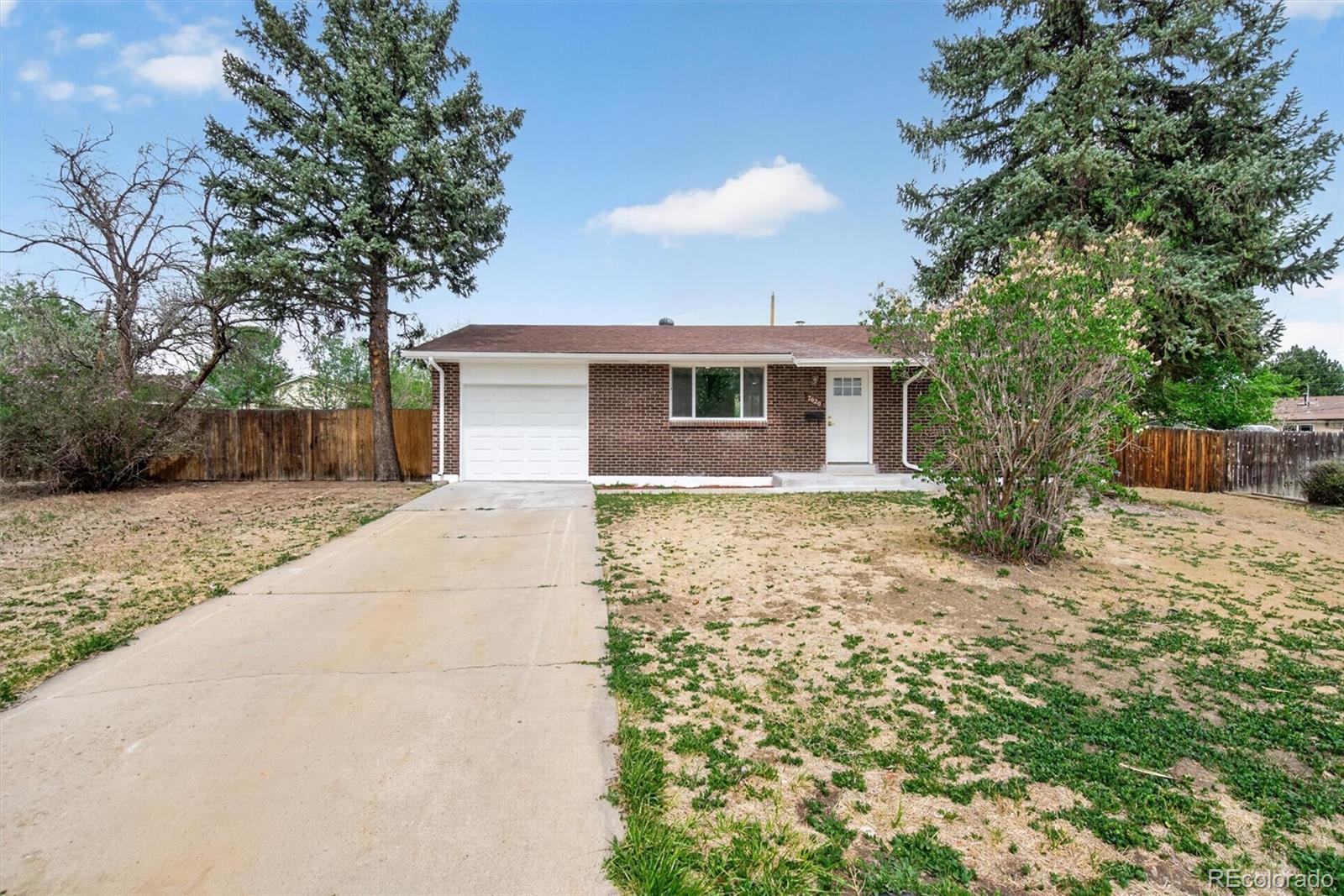 7620 Acoma Court Denver, CO 80221 - Photo 3 of 39 a front view of a house with garden