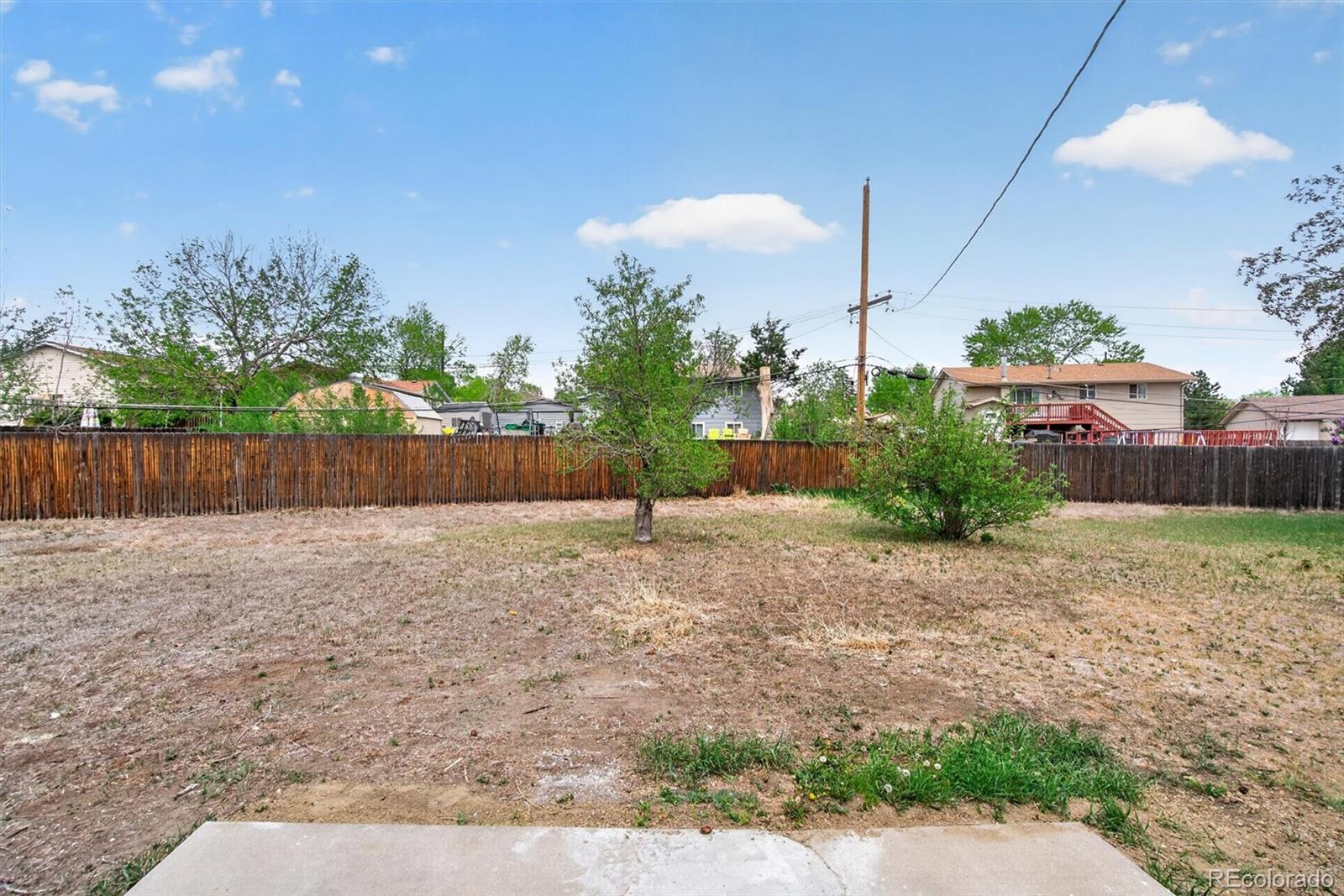 7620 Acoma Court Denver, CO 80221 - Photo 34 of 39 a backyard of a house