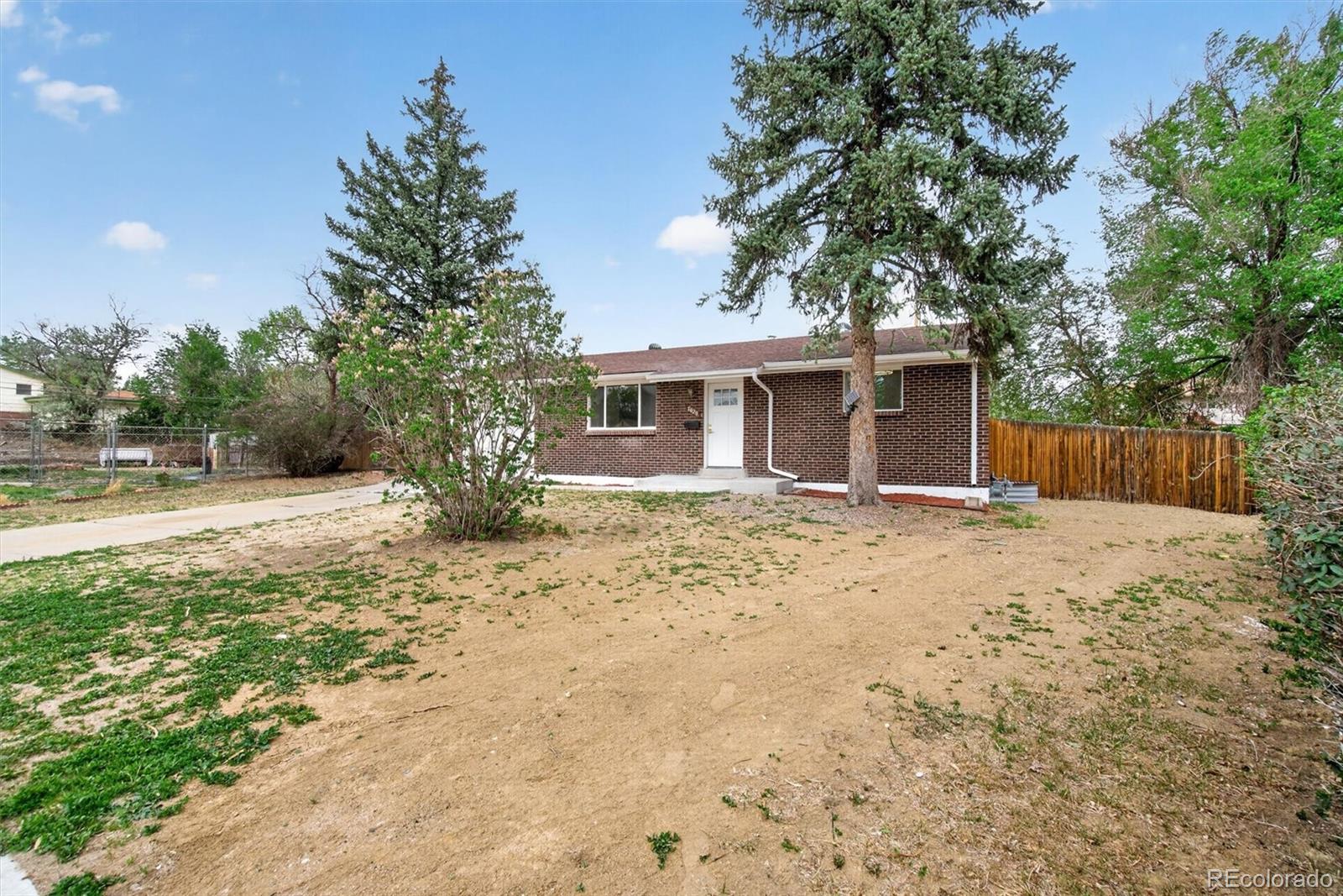 7620 Acoma Court Denver, CO 80221 - Photo 5 of 39 a view of a house with a yard