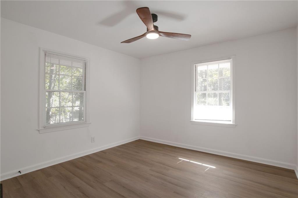 2326 Mark Trail Decatur, GA 30032 - Photo 11 of 19 a view of an empty room with wooden floor and a window