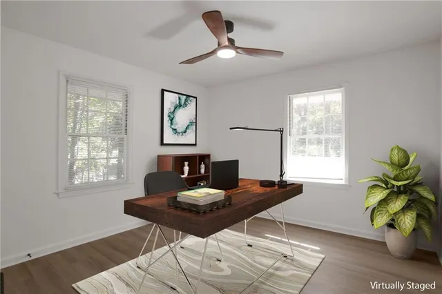 a workspace with furniture and a potted plant