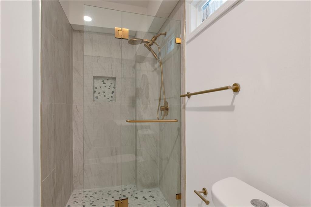 2326 Mark Trail Decatur, GA 30032 - Photo 17 of 19 a bathroom with a shower and toilet