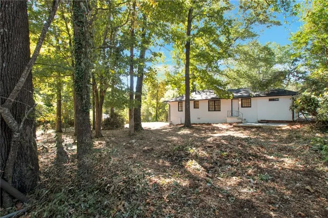 a view of a house with a tree