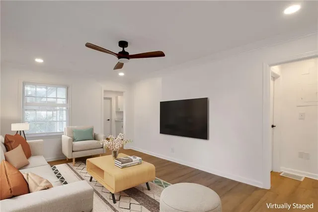 a living room with furniture and a flat screen tv