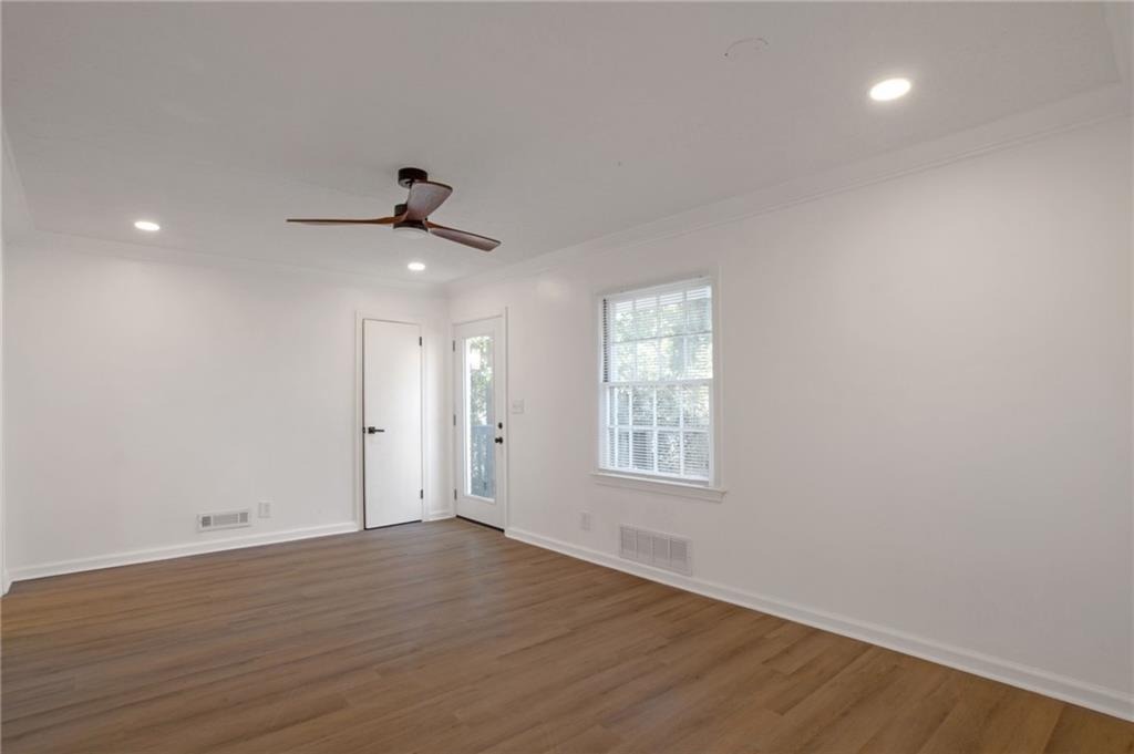 2326 Mark Trail Decatur, GA 30032 - Photo 6 of 19 an empty room with wooden floor and windows