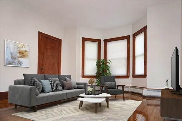 a living room with furniture and a large window