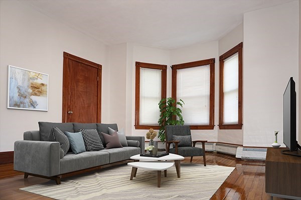 85 Brown Street, Unit 2 Waltham, MA 02453 - Photo 3 of 8 a living room with furniture and a large window