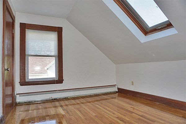 85 Brown Street, Unit 2 Waltham, MA 02453 - Photo 5 of 8 a view of a room that has a window