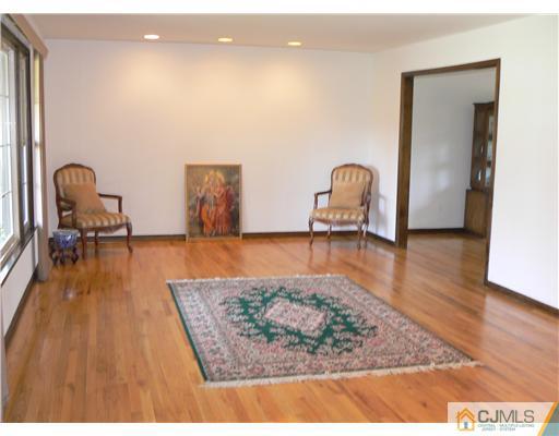 11 Pine Ridge Drive Edison, NJ 08820 - Photo 11 of 25 a living room with furniture and a rug