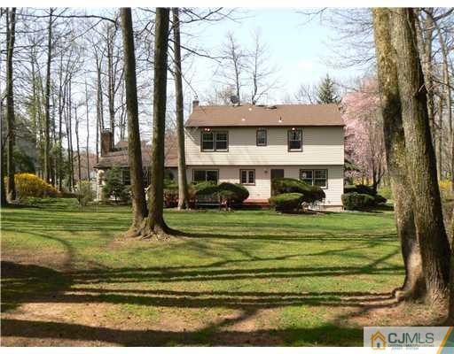 11 Pine Ridge Drive Edison, NJ 08820 - Photo 13 of 25 a front view of a house with a yard