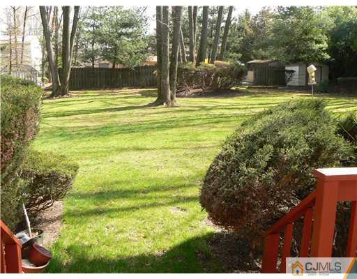 11 Pine Ridge Drive Edison, NJ 08820 - Photo 14 of 25 a view of a house with a yard