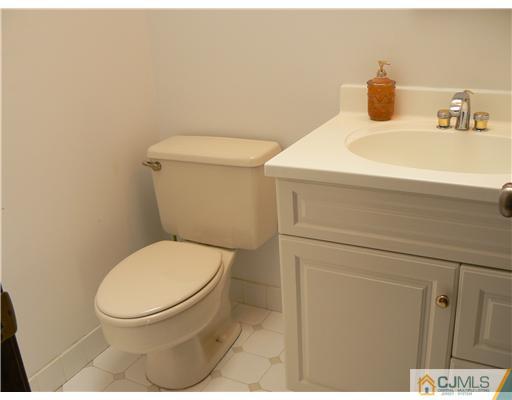 11 Pine Ridge Drive Edison, NJ 08820 - Photo 16 of 25 a bathroom with a toilet and a sink
