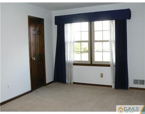11 Pine Ridge Drive Edison, NJ 08820 - Photo 22 of 25 an empty room with windows