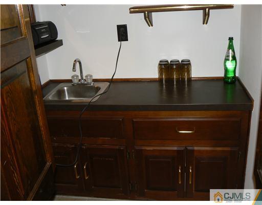 11 Pine Ridge Drive Edison, NJ 08820 - Photo 9 of 25 a bathroom with a sink and a mirror
