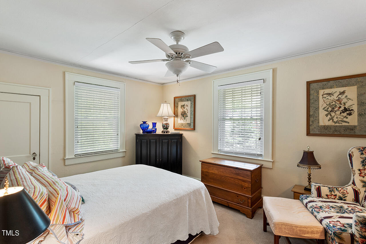 904 North Gregson Street Durham, NC 27701 - Photo 16 of 34 a bedroom with a bed and a window