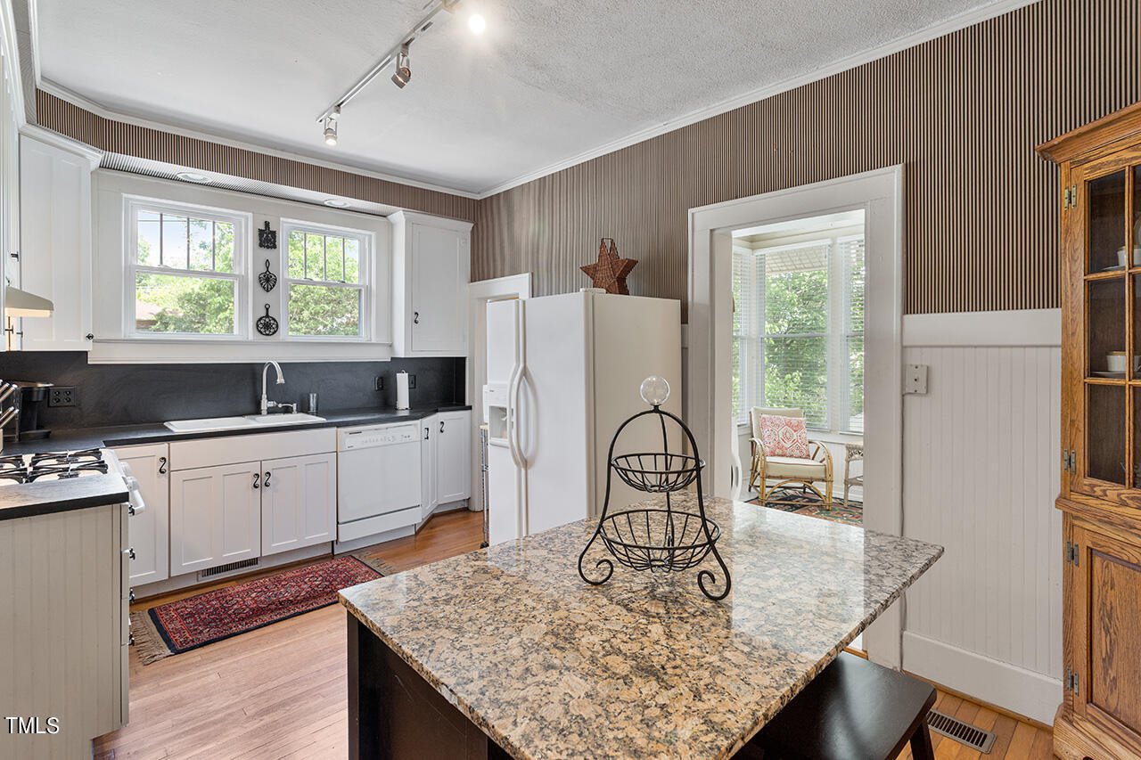 904 North Gregson Street Durham, NC 27701 - Photo 23 of 34 a kitchen with sink refrigerator and large window