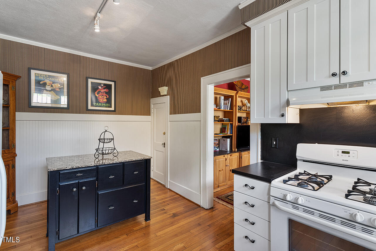 904 North Gregson Street Durham, NC 27701 - Photo 25 of 34 a kitchen with stainless steel appliances a stove refrigerator and cabinets