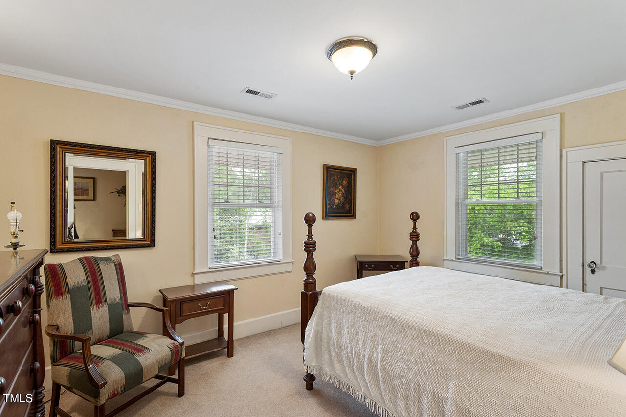 904 North Gregson Street Durham, NC 27701 - Photo 30 of 34 a bedroom with a bed and a couch