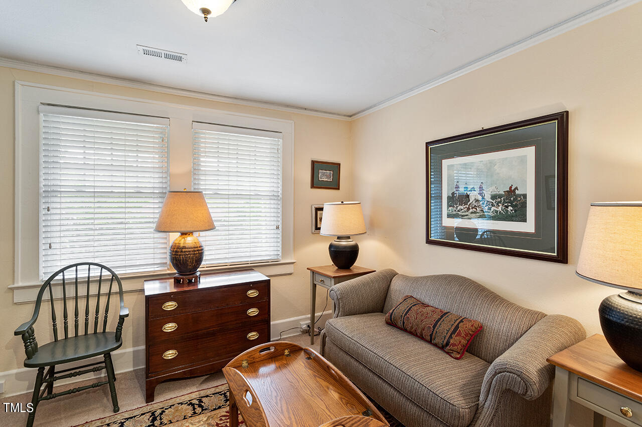 904 North Gregson Street Durham, NC 27701 - Photo 31 of 34 a living room with furniture and a lamp
