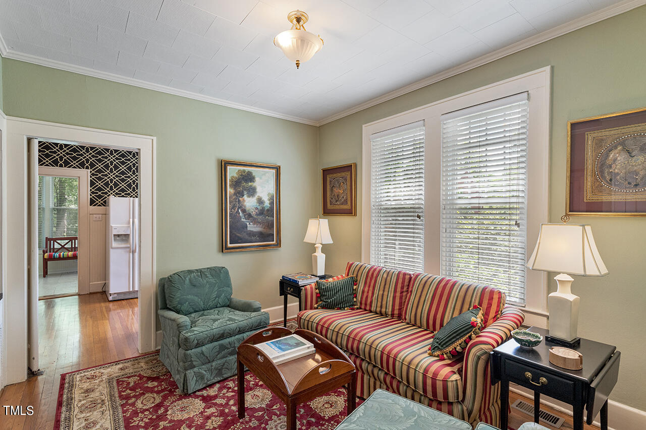 904 North Gregson Street Durham, NC 27701 - Photo 5 of 34 a living room with furniture a lamp and a window