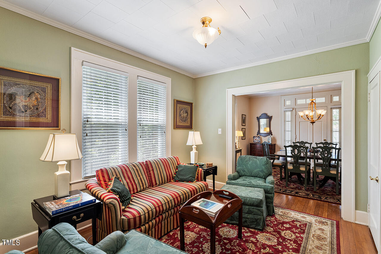 904 North Gregson Street Durham, NC 27701 - Photo 6 of 34 a living room with furniture two lamps and wooden floor