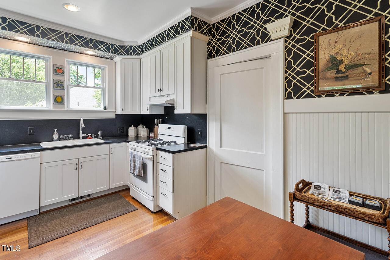 904 North Gregson Street Durham, NC 27701 - Photo 10 of 34 a kitchen with a refrigerator stove and sink