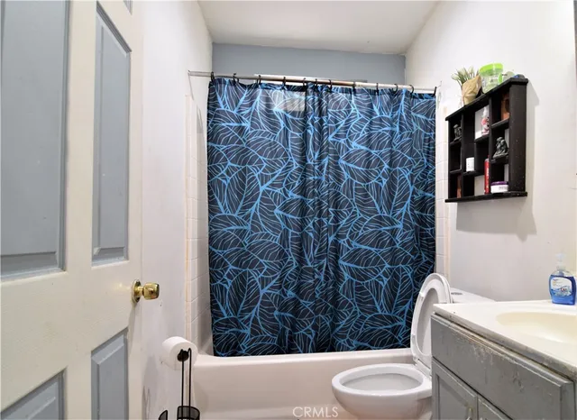 a kitchen with stainless steel appliances granite countertop a refrigerator stove microwave and sink