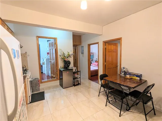 a living room with furniture a window and a table