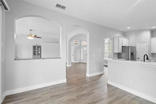 a living room with furniture a rug and a flat screen tv