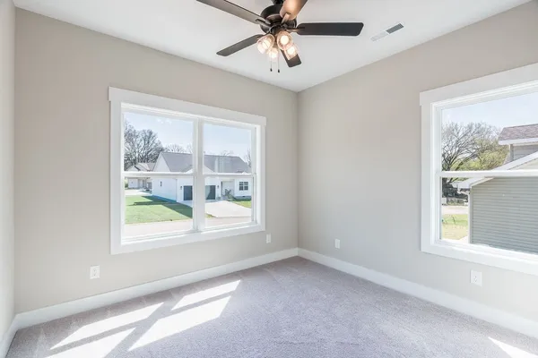 a view of an empty room with a window