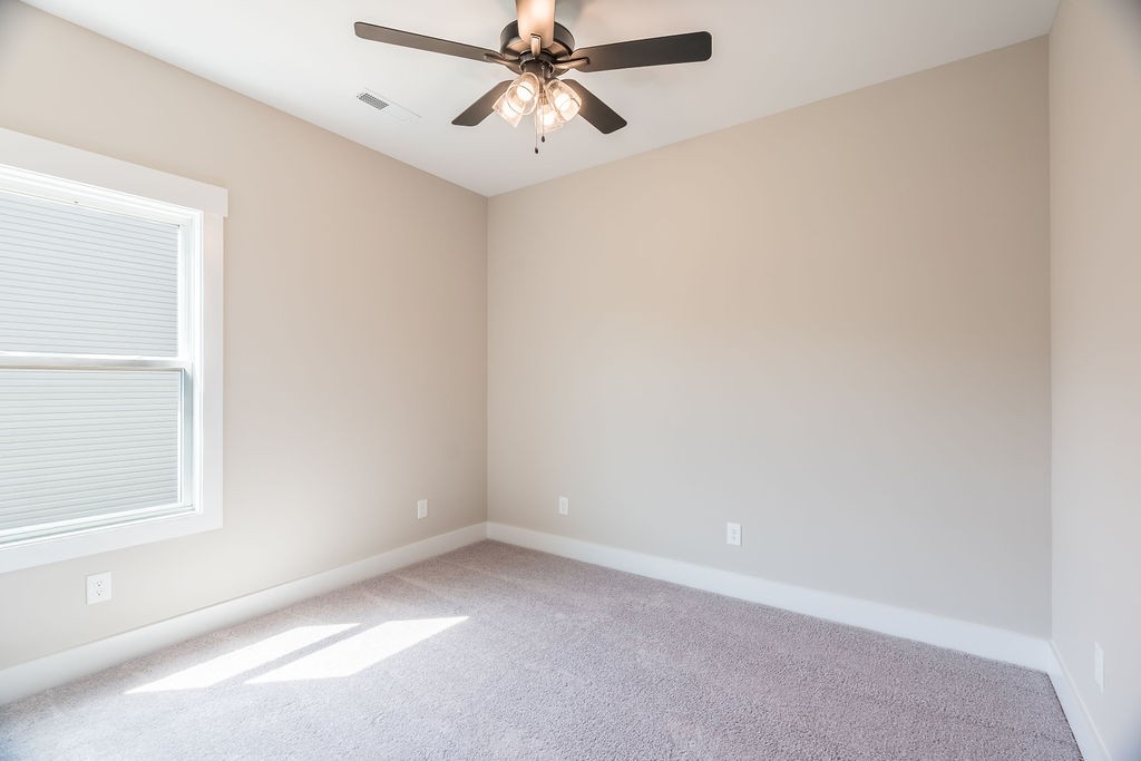 104 Bee Line Way Trenton, KY 42286 - Photo 20 of 23 an empty room with windows and fan