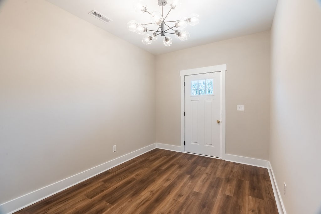 104 Bee Line Way Trenton, KY 42286 - Photo 2 of 23 a view of room with window and hardwood floor