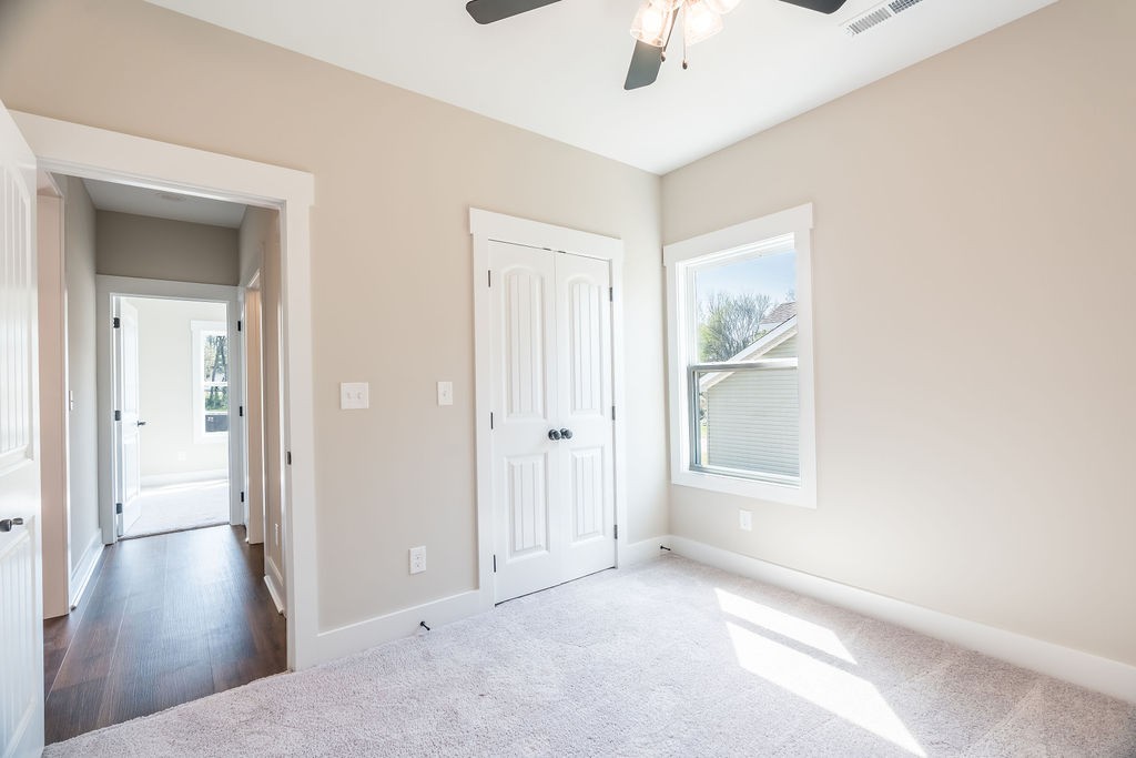 104 Bee Line Way Trenton, KY 42286 - Photo 21 of 23 a view of a livingroom with a ceiling fan and wooden floor