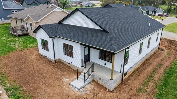 an aerial view of a house having yard