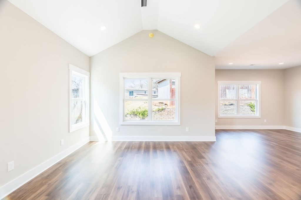 104 Bee Line Way Trenton, KY 42286 - Photo 3 of 23 an empty room with wooden floor and windows