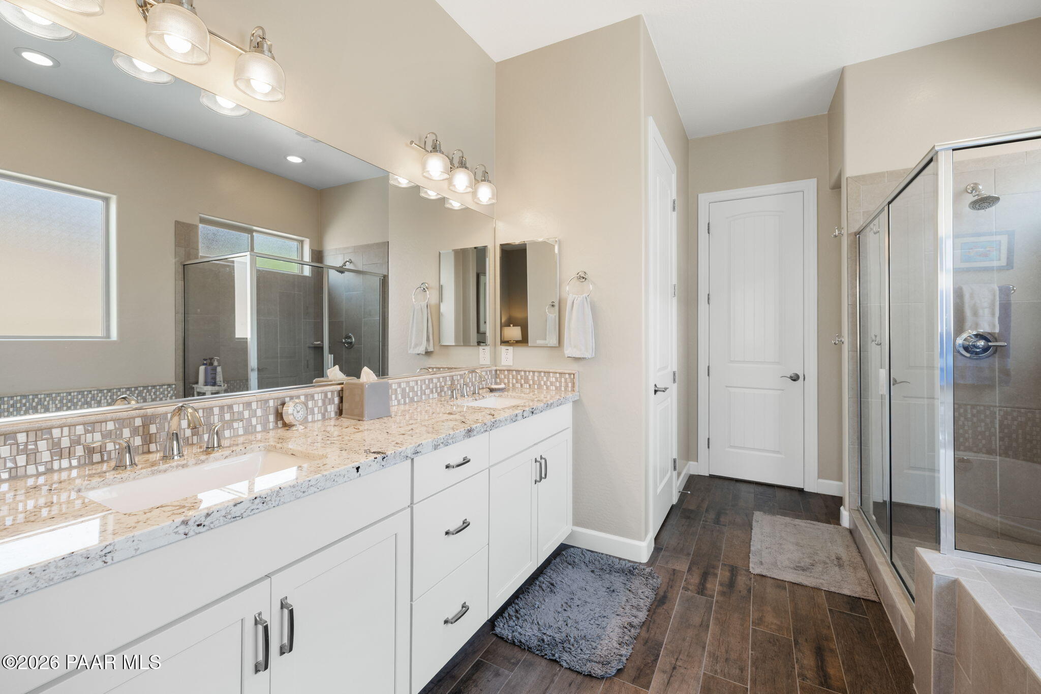 2792 Brooks Range Prescott, AZ 86301 - Photo 25 of 35 a bathroom with a double vanity sink and mirror with shower