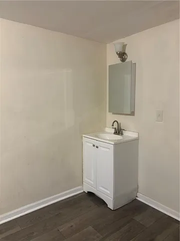 a bathroom with a sink and mirror