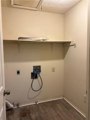 a bathroom with a granite countertop toilet and a sink