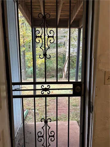 a view of utility room with wooden floor