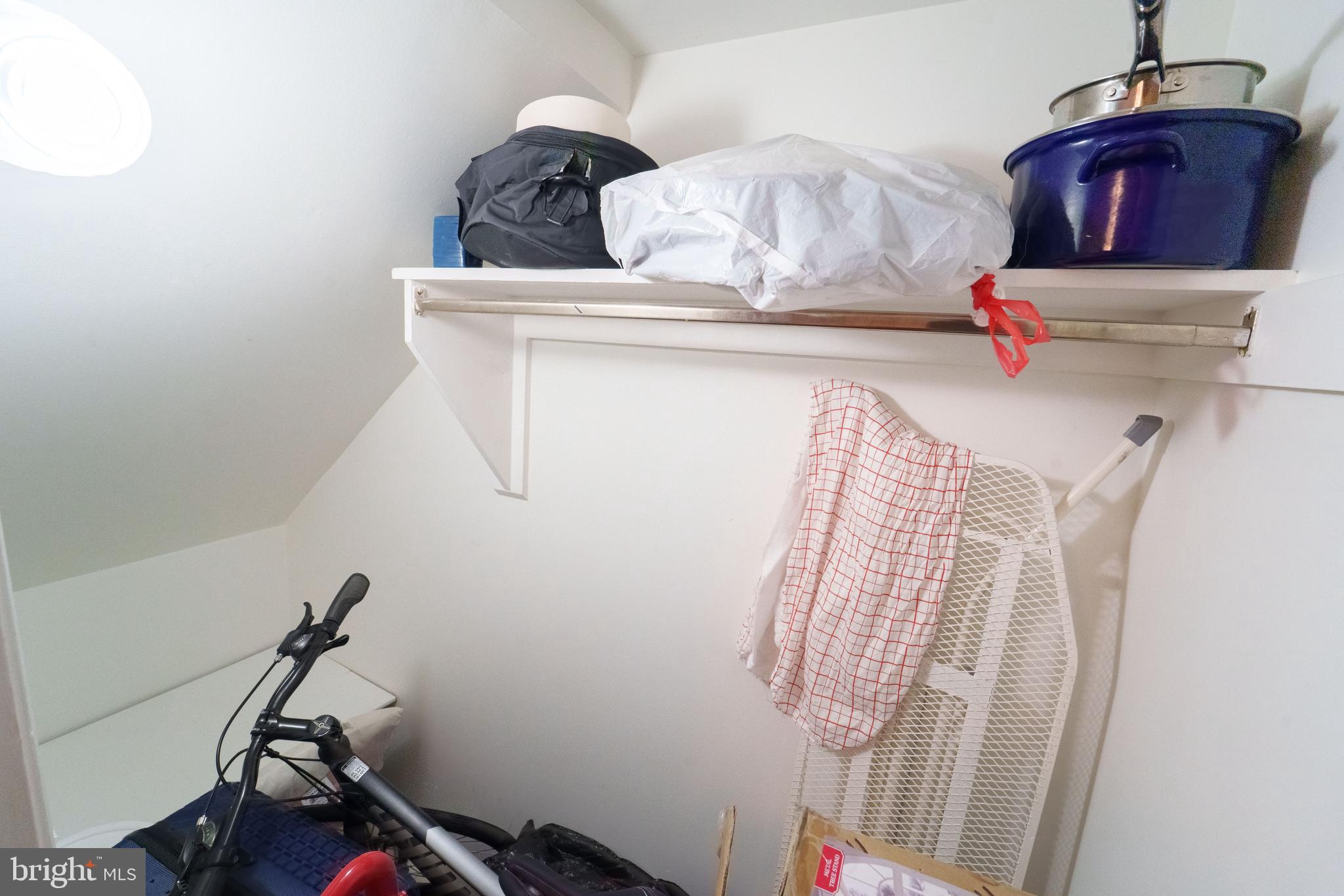 7625 Tiverton Drive, Unit 7625 Springfield, VA 22152 - Photo 20 of 22 a view of storage and utility room with racks on the wall