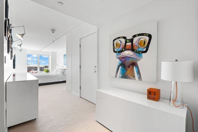 a view of living room with furniture and wooden floor