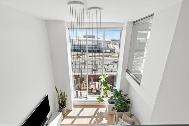 a view of a livingroom with furniture and lounge chair