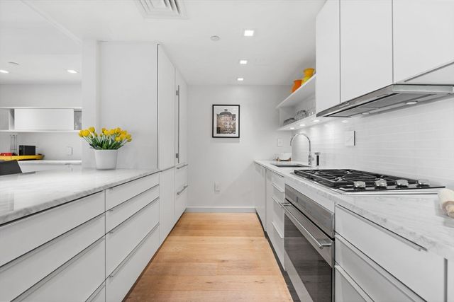 a kitchen with a stove and a sink