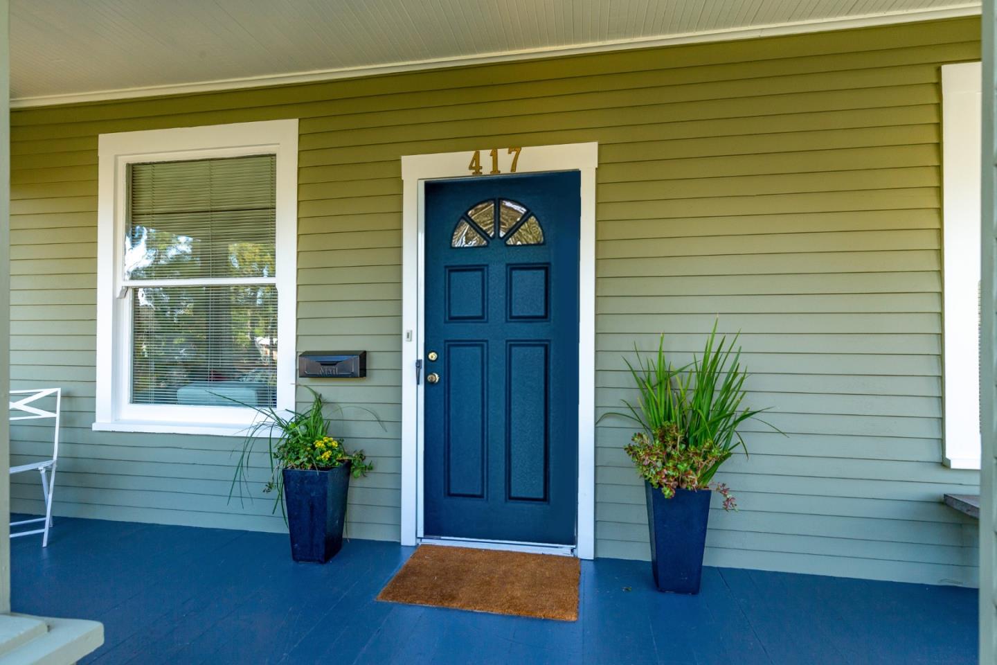 417 Mountain View Avenue Mountain View, CA 94041 - Photo 1 of 22 a vase of flowers sitting on a wooden floor