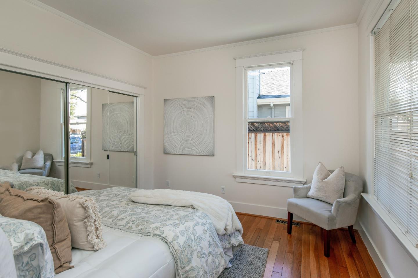 417 Mountain View Avenue Mountain View, CA 94041 - Photo 8 of 22 a bedroom with a bed wooden floor and windows