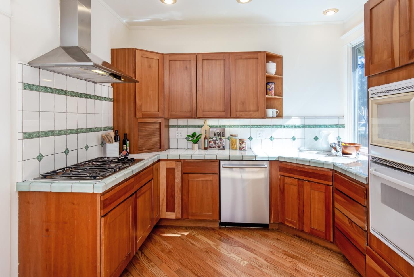 417 Mountain View Avenue Mountain View, CA 94041 - Photo 10 of 22 a kitchen with stainless steel appliances granite countertop a sink stove and cabinets