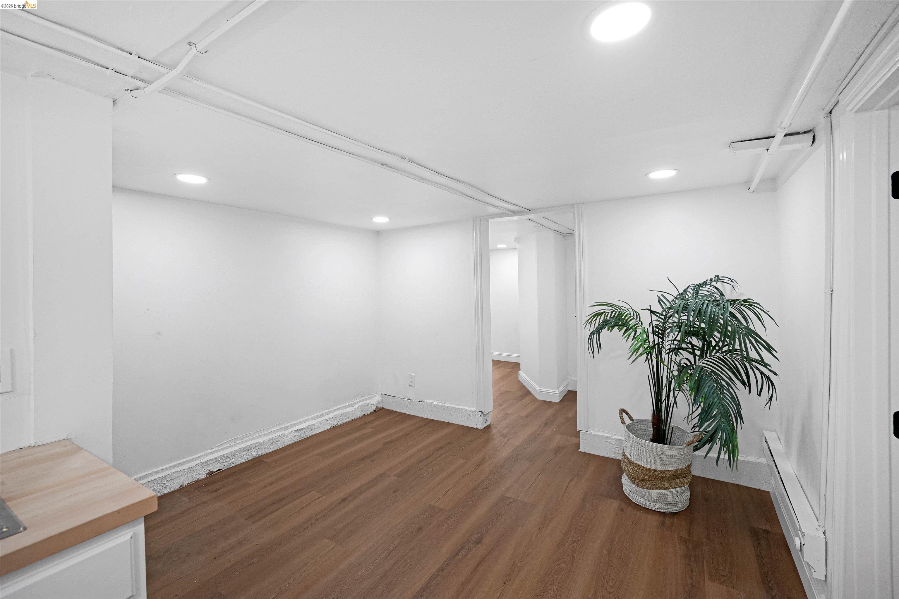 1812 Woolsey Street Berkeley, CA 94703 - Photo 35 of 48 Spacious interior featuring wood-finish flooring, recessed lighting, and white walls