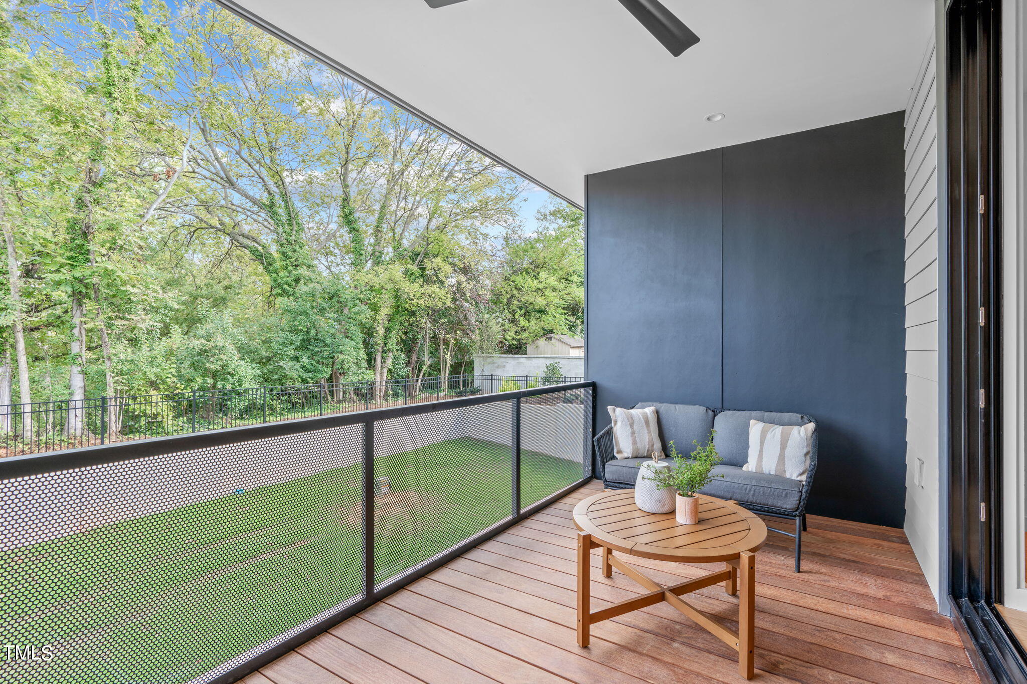 501 South Bloodworth Street, Unit 101 Raleigh, NC 27601 - Photo 14 of 55 a view of a chair and tables in the balcony