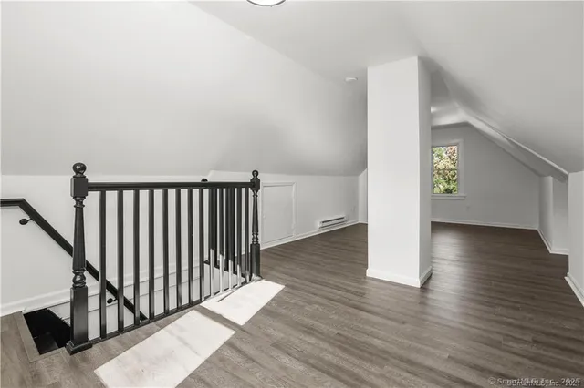 a view of entryway with wooden floor